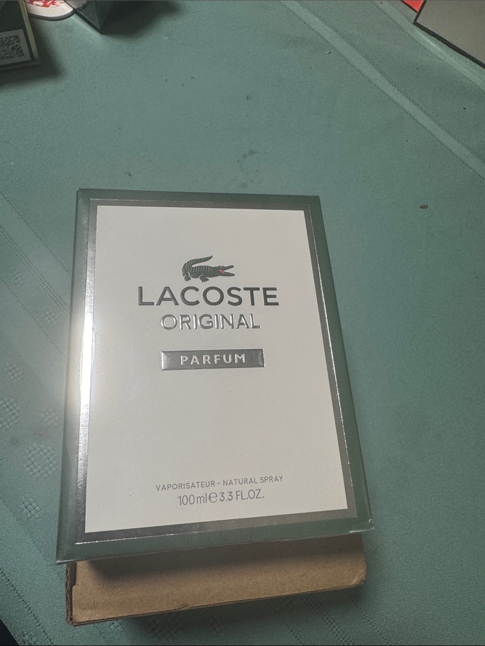 Lacoste Parfum in White, Green and Silver Accents
